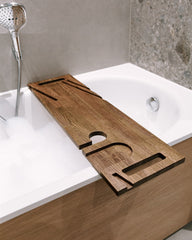 Wooden bathtub tray on a bathtub with a neutral tiled wall background