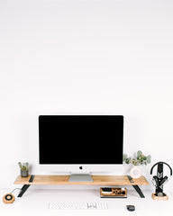 Modern office desk with computer setup on a white background