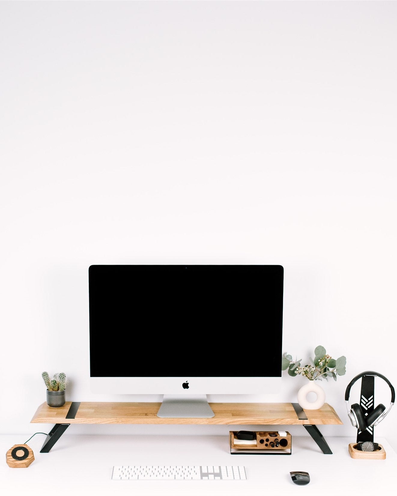 Modern office desk with computer setup on a white background