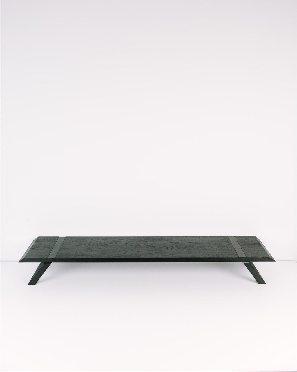 Rectangular black metal table on a white background