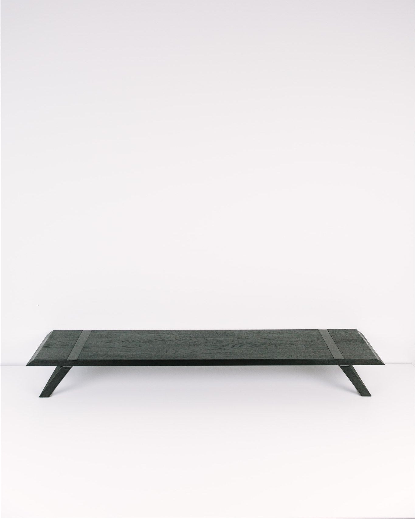 Rectangular black metal table on a white background