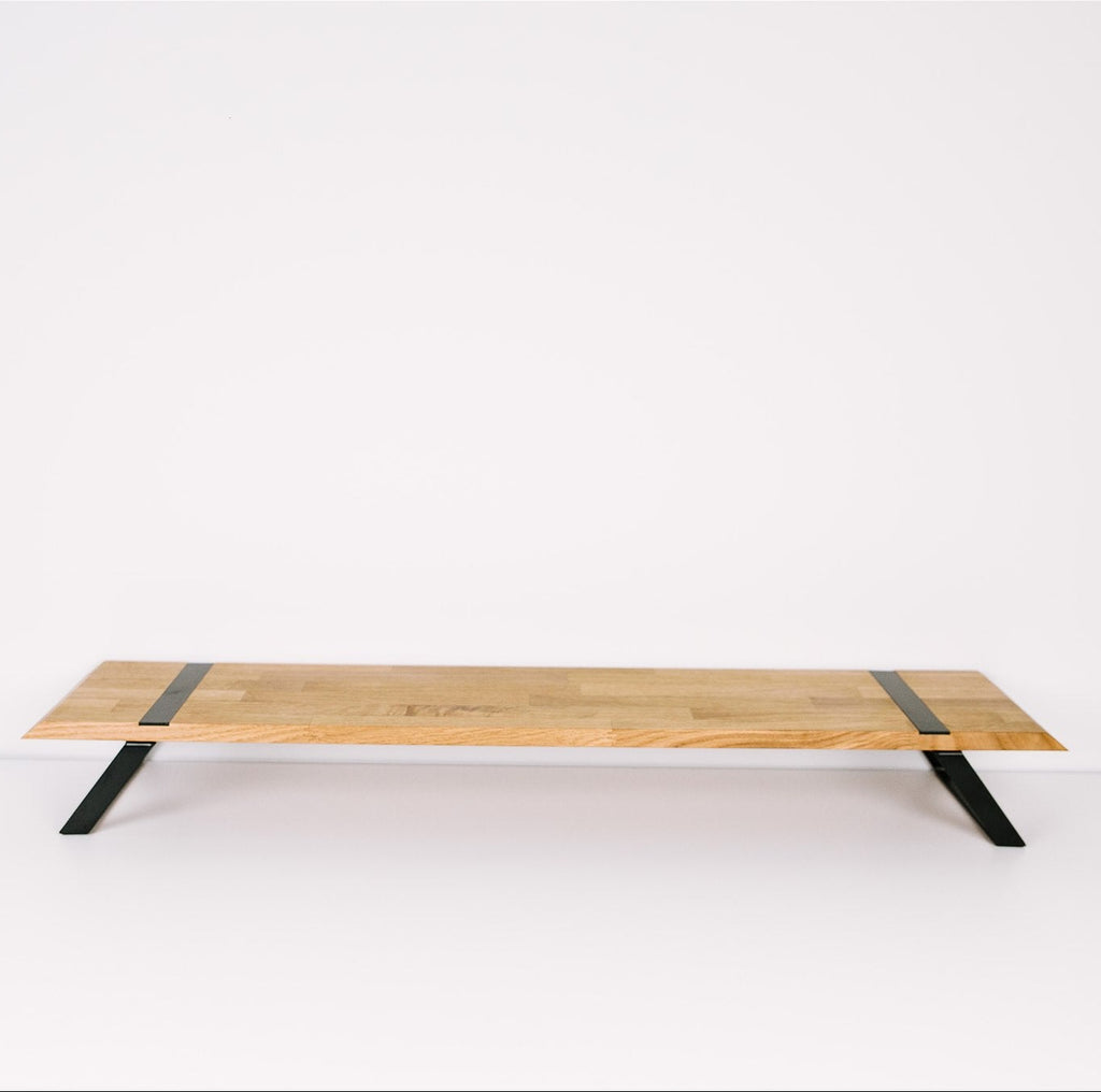 Dual monitor stand on clean background solid oak