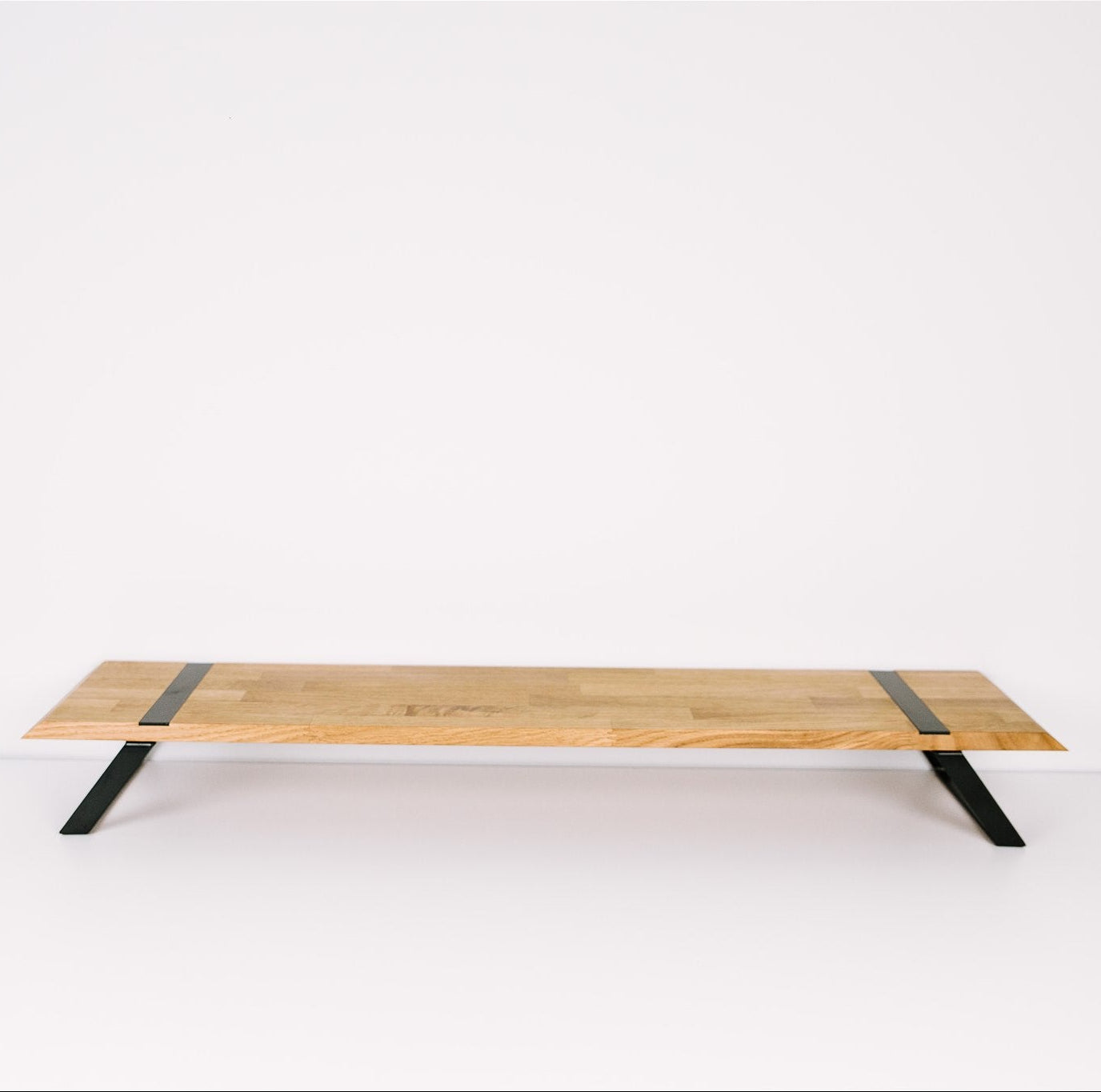 Dual monitor stand on clean background solid oak