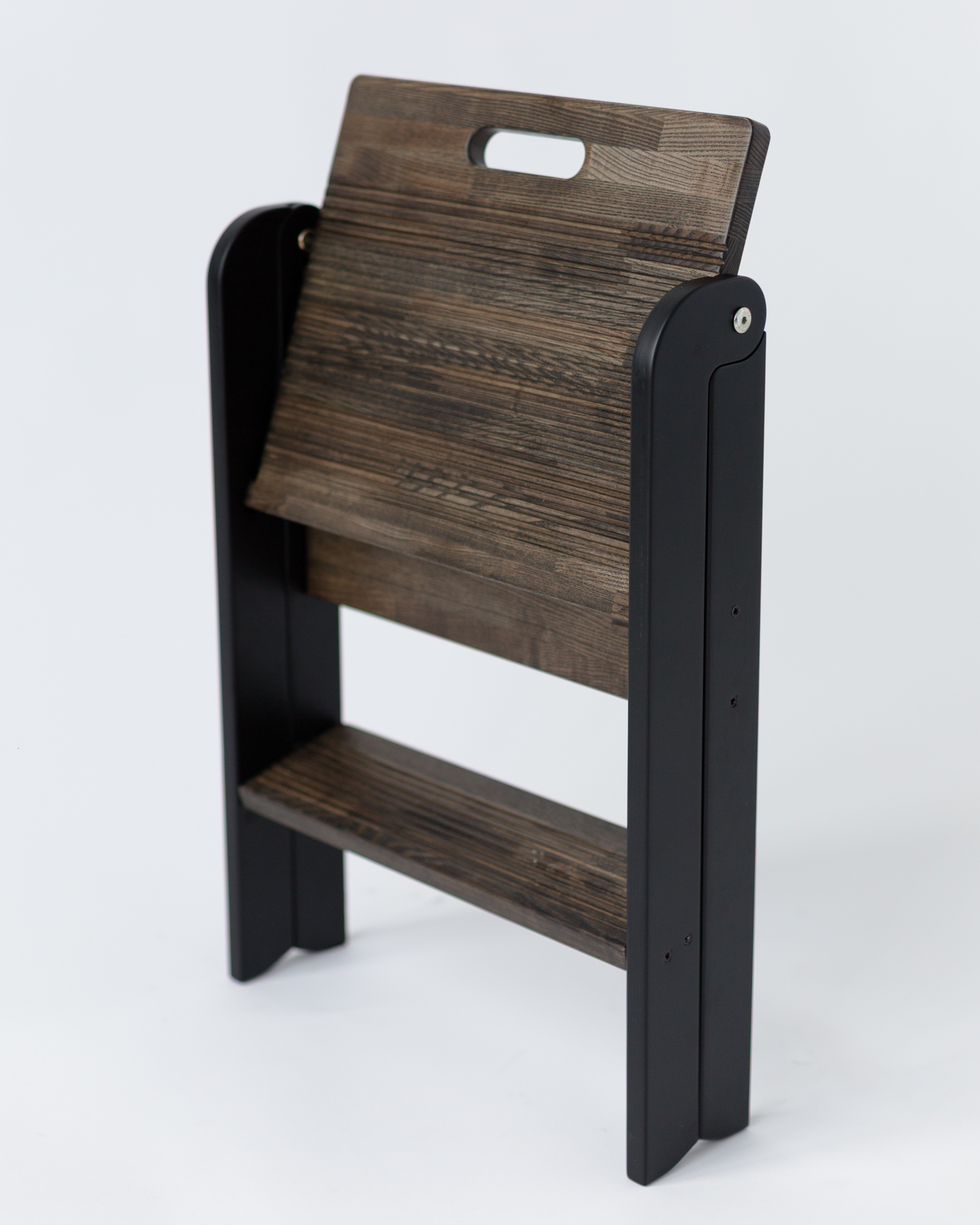 Wooden chair with black frame on a white background
