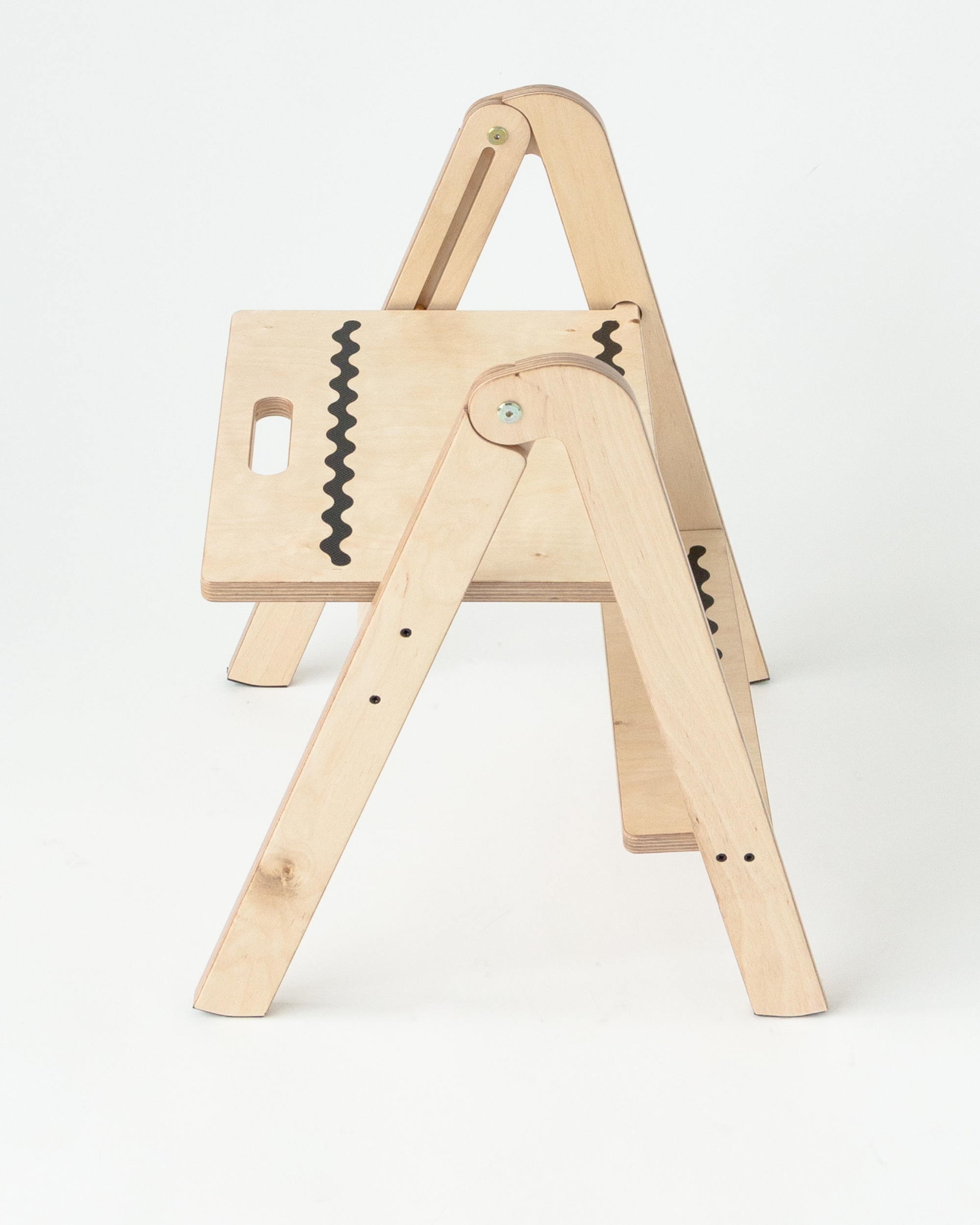 Wooden step stool with anti slip design on a white background