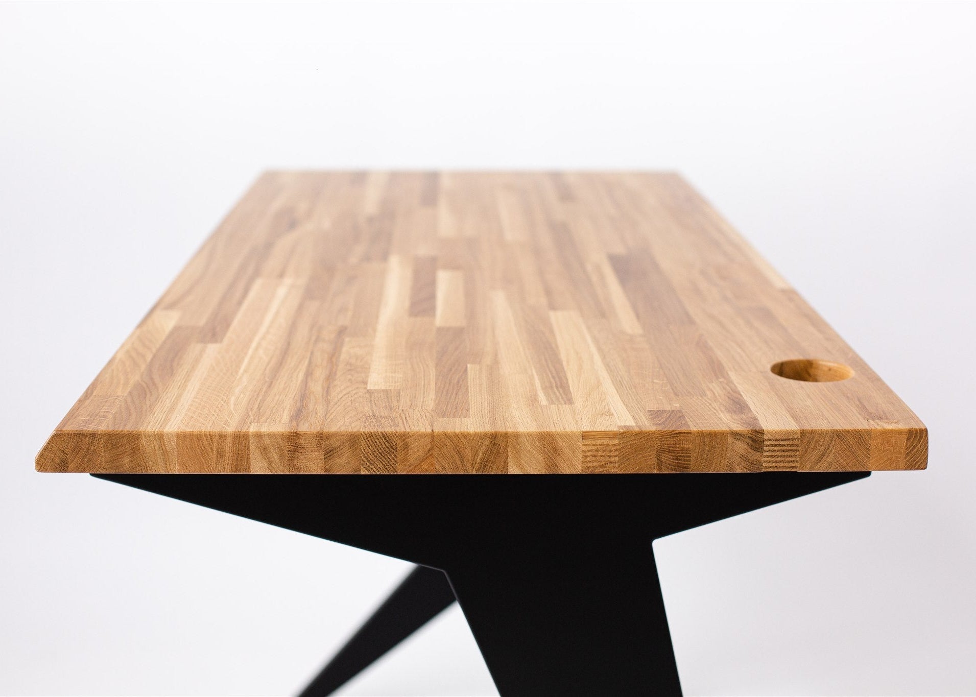 Wooden cutting board with a black base on a white background