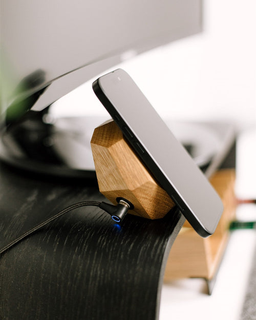 Phone on a wooden stand with blurred background